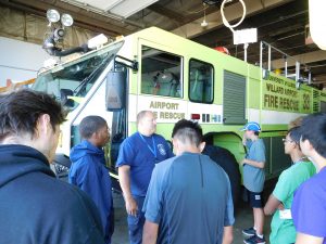 Students at Willard airport learning about emergency response team