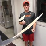High school student with model glider