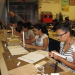 High school students building models during workshop